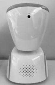 AV1 Avatar Ein Avatar AV1 steht auf einem weißen Tisch vor einer grauen Wand